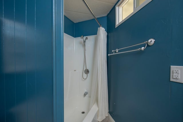 full bath featuring shower / tub combo with curtain