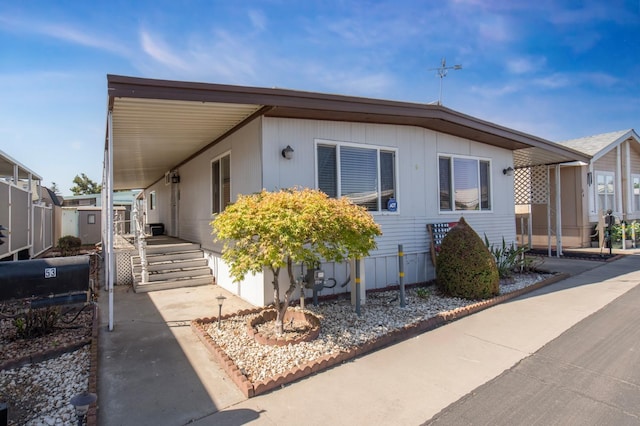 view of front of home with a carport