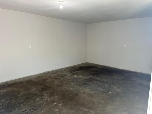 spare room featuring concrete flooring