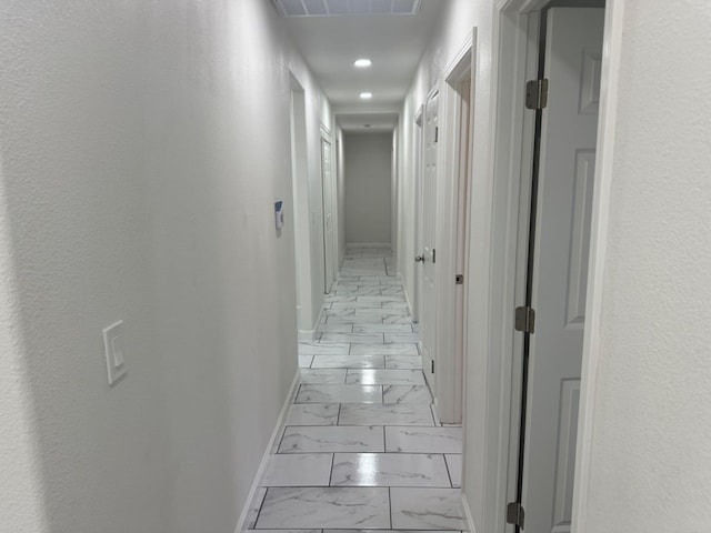 corridor featuring light tile patterned flooring