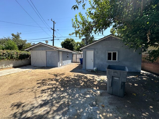 view of side of home with a storage shed