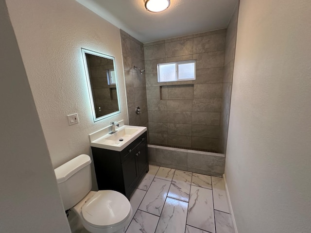 full bathroom featuring vanity, toilet, tile patterned floors, and tiled shower / bath