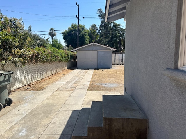 view of patio featuring a storage unit