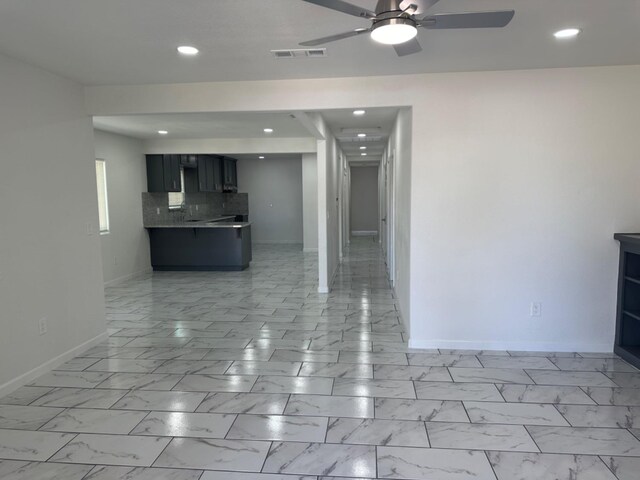 interior space with ceiling fan and light tile patterned flooring