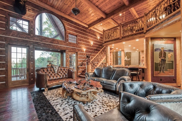 living room featuring wooden ceiling, beamed ceiling, a healthy amount of sunlight, and dark hardwood / wood-style floors