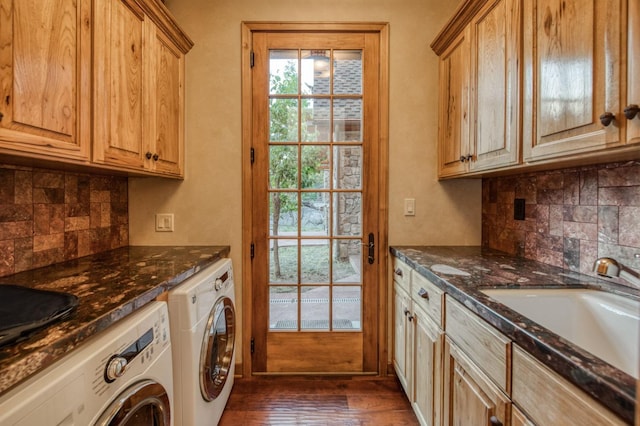 washroom featuring washer and dryer, cabinets, dark hardwood / wood-style floors, and sink