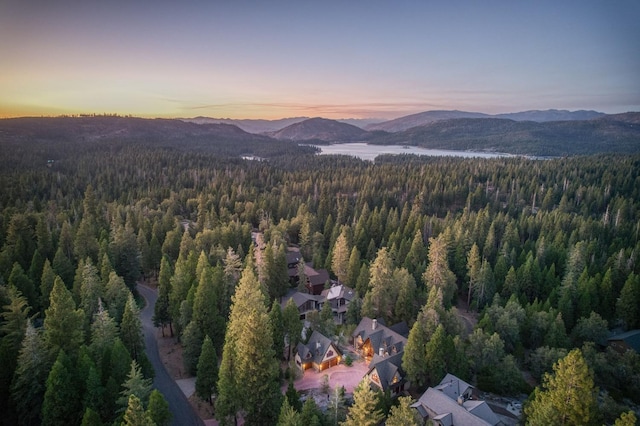 aerial view at dusk featuring a mountain view