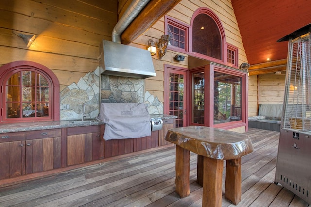 deck featuring grilling area and sink