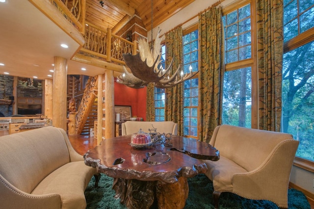 dining area with wooden ceiling and a high ceiling