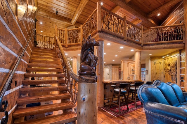 interior space featuring wooden ceiling, high vaulted ceiling, hardwood / wood-style floors, and beam ceiling