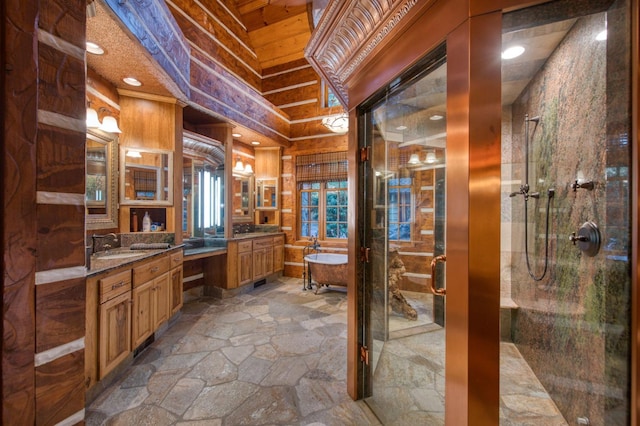 bathroom featuring vanity, independent shower and bath, and tile patterned flooring