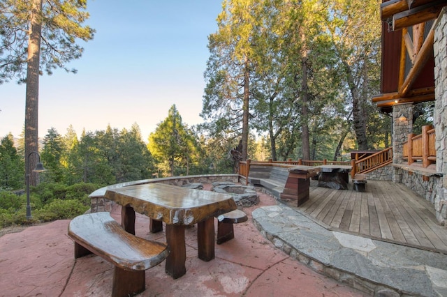 patio terrace at dusk with a wooden deck