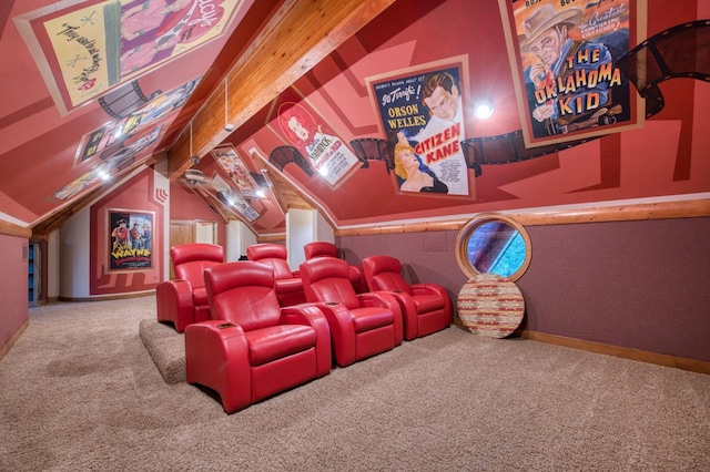 carpeted cinema room with lofted ceiling