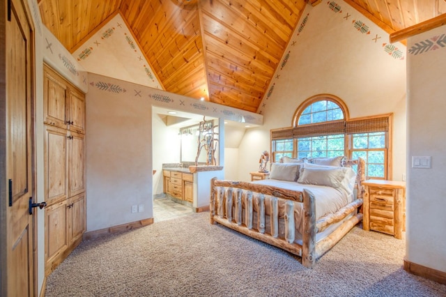 bedroom featuring ensuite bath, high vaulted ceiling, light carpet, and wooden ceiling