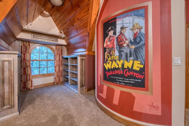 hall with wood walls and carpet floors