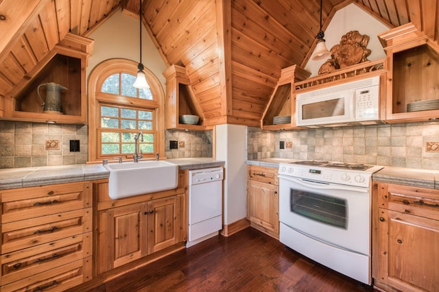 kitchen featuring decorative light fixtures, white appliances, dark wood-type flooring, tile counters, and tasteful backsplash