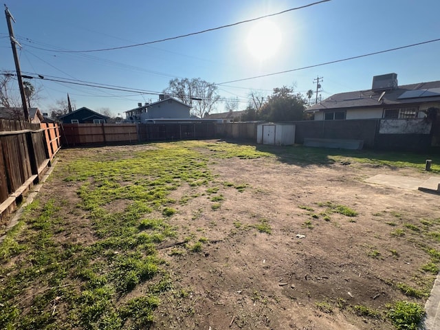 view of yard with a storage unit