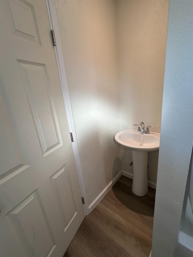 bathroom featuring wood-type flooring