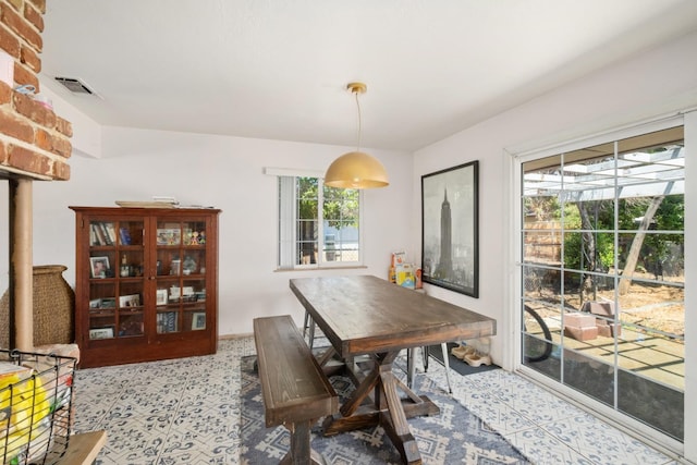 dining room featuring plenty of natural light