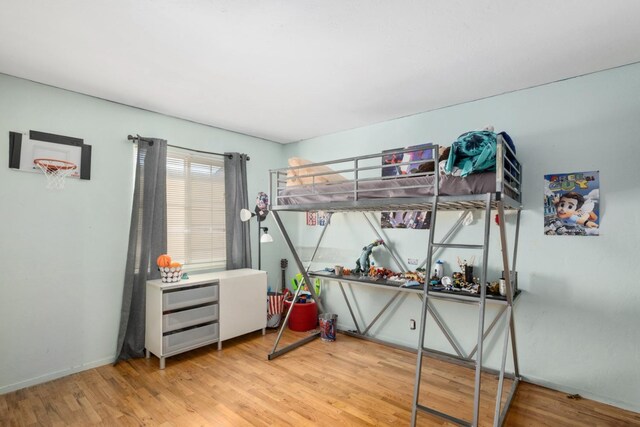 bedroom with light wood-type flooring