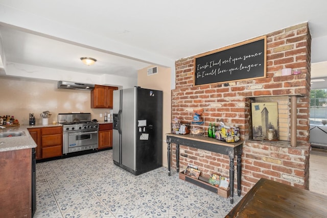 kitchen with light tile patterned floors, appliances with stainless steel finishes, beam ceiling, extractor fan, and sink