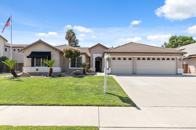 view of front of house with a garage and a front yard