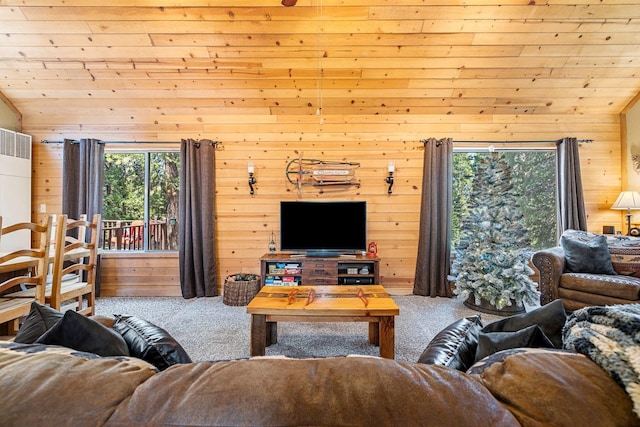 carpeted living room featuring vaulted ceiling, wooden walls, and wood ceiling