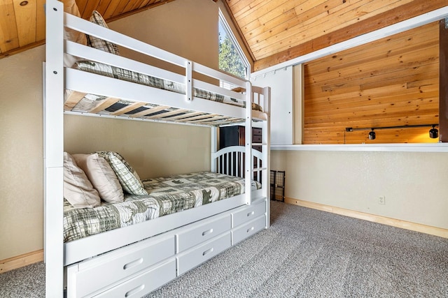 unfurnished bedroom featuring lofted ceiling, carpet flooring, and wooden ceiling