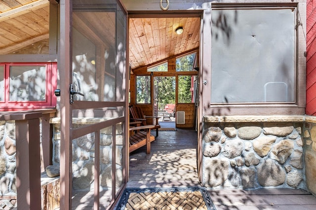 miscellaneous room featuring lofted ceiling, hardwood / wood-style flooring, and wooden ceiling