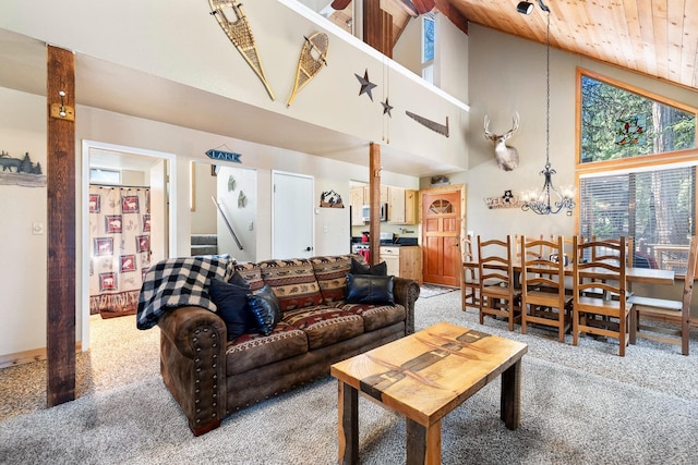 carpeted living room with high vaulted ceiling and wood ceiling