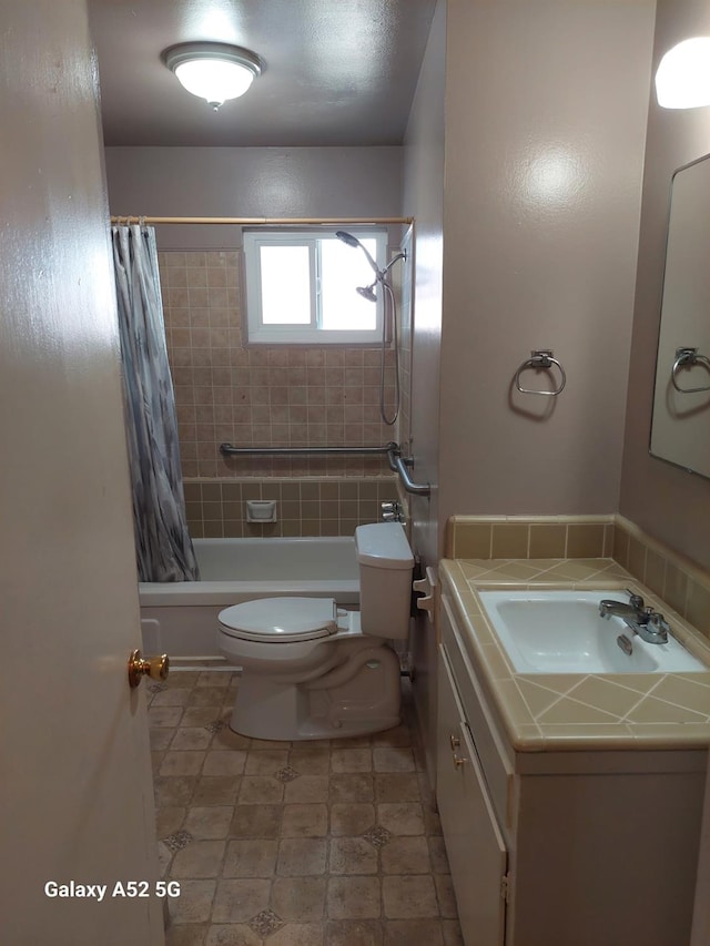 full bathroom featuring vanity, toilet, and shower / bath combo with shower curtain