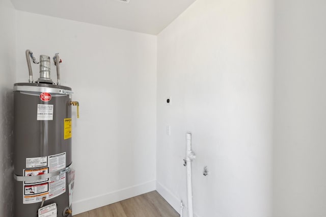 utility room with water heater