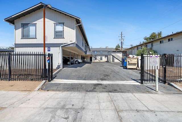 view of front of property featuring a carport