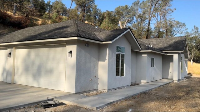 view of property exterior with a garage