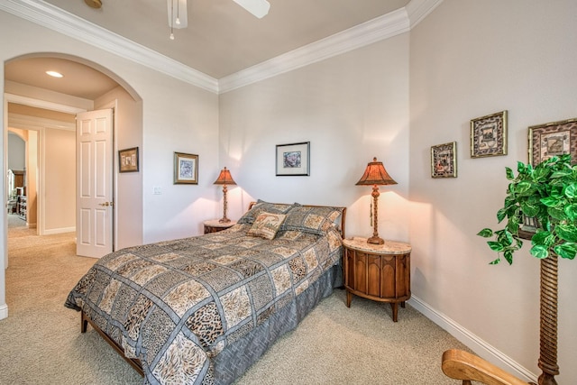 carpeted bedroom with crown molding and ceiling fan