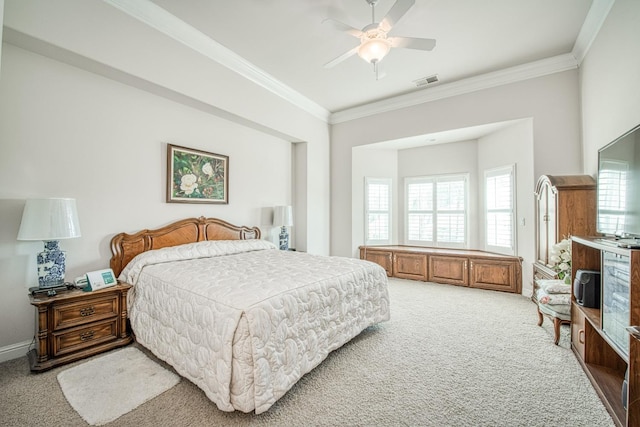 bedroom featuring ceiling fan, light colored carpet, and ornamental molding