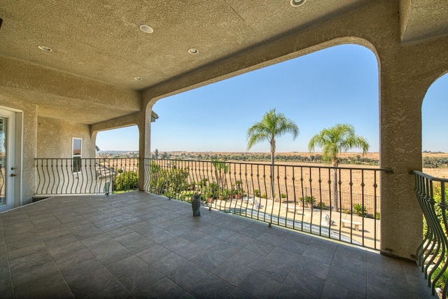 view of patio with a balcony