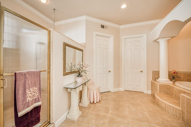 bathroom featuring ornamental molding, ornate columns, and separate shower and tub