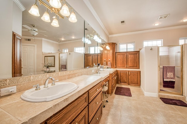 bathroom featuring a shower with door, vanity, ceiling fan, and crown molding