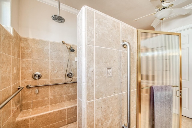 bathroom with a shower with shower door, ceiling fan, and ornamental molding