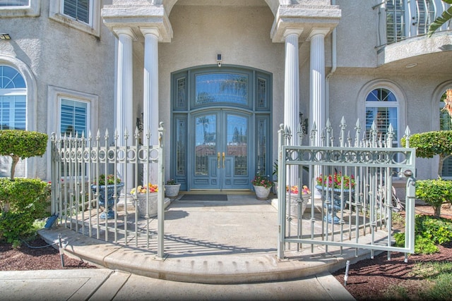 view of exterior entry featuring french doors