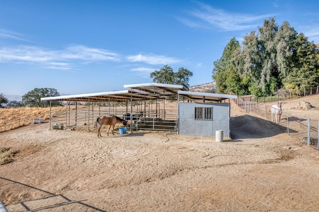 view of outbuilding featuring a rural view