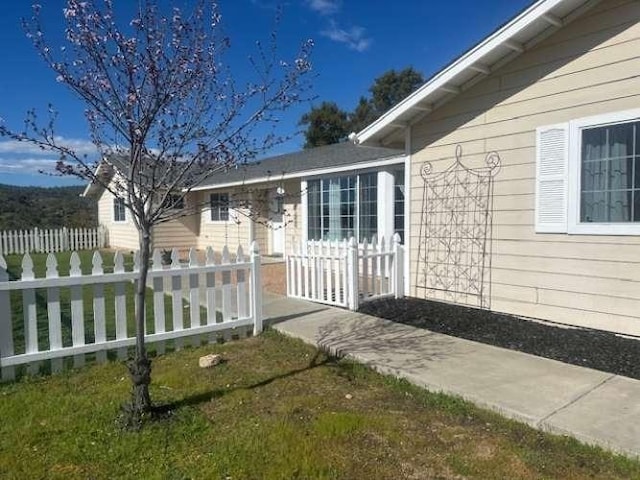 doorway to property featuring fence