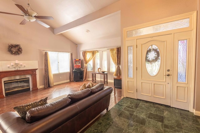 foyer with vaulted ceiling with beams and ceiling fan