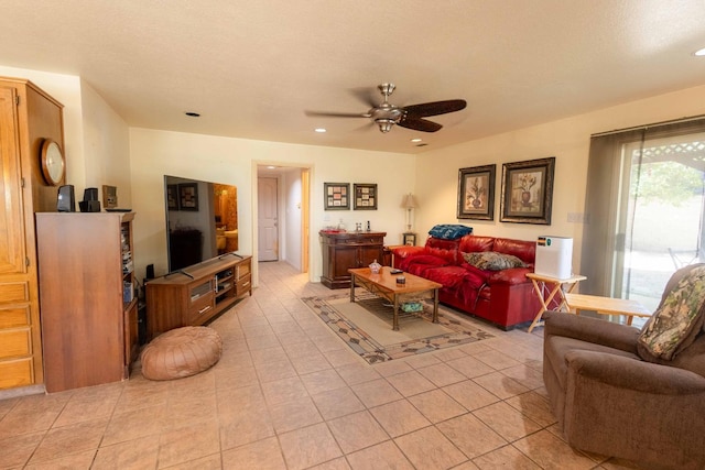 tiled living room featuring ceiling fan and a textured ceiling