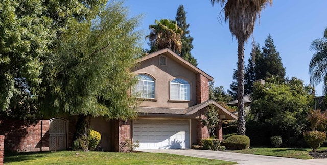 view of front property featuring a front lawn and a garage