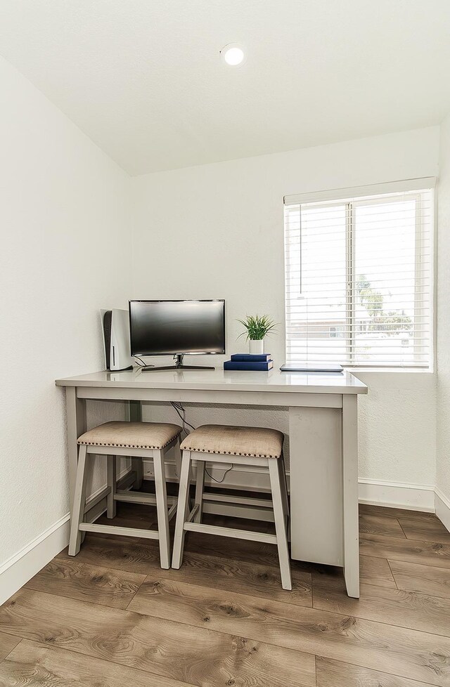 office featuring wood finished floors and baseboards