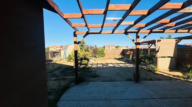 view of patio / terrace with fence and a pergola