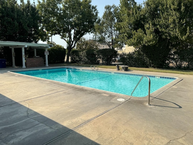 outdoor pool featuring a patio