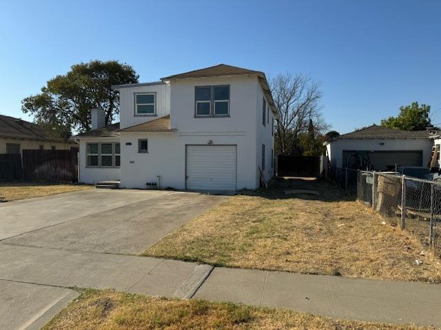 front facade with a garage